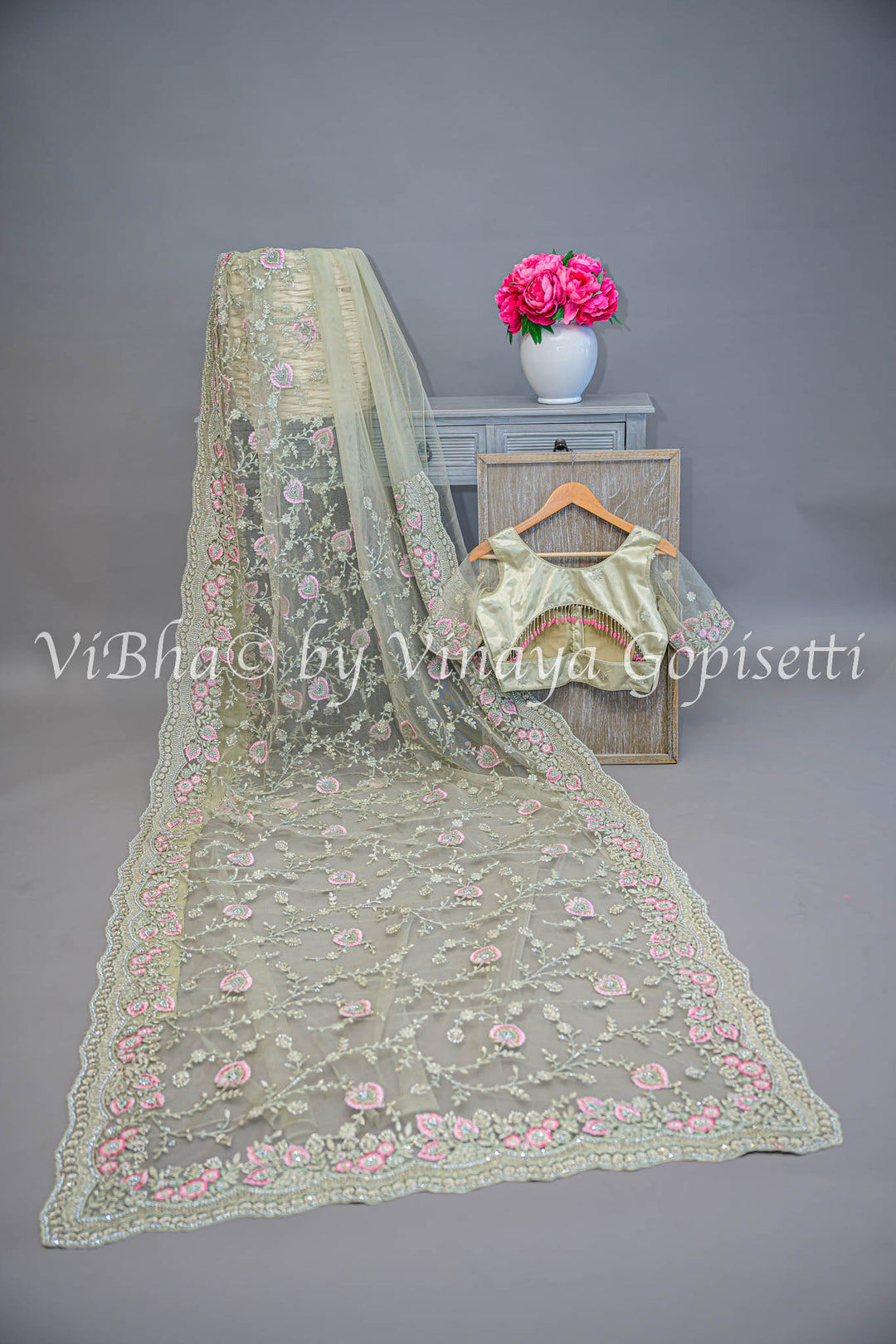 Pastel green embroidered saree