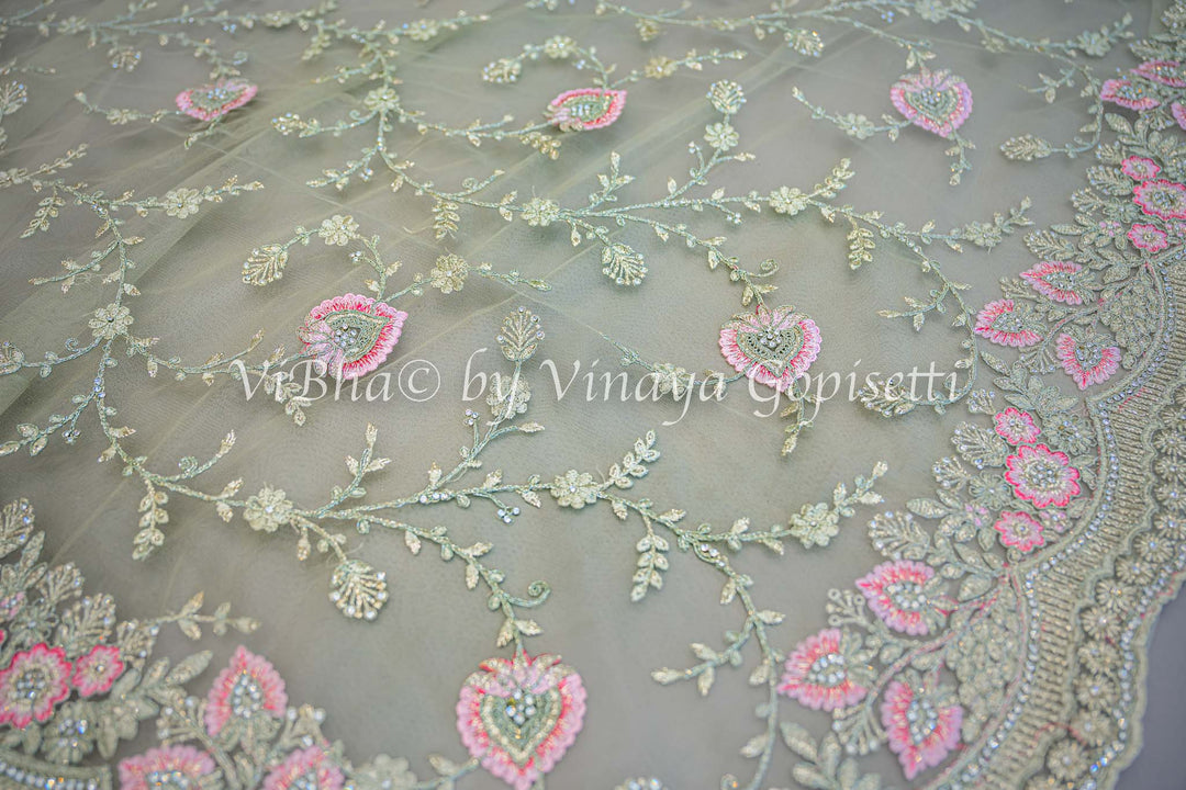 Pastel green embroidered saree