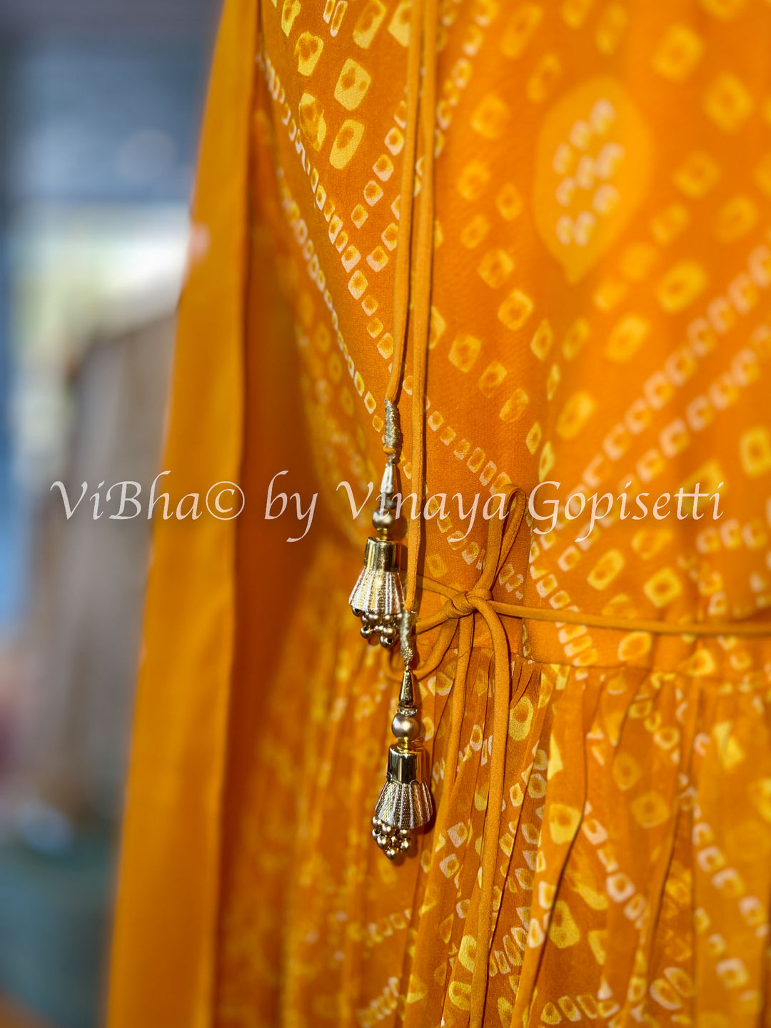 Orangish Yellow Bandhej Gown