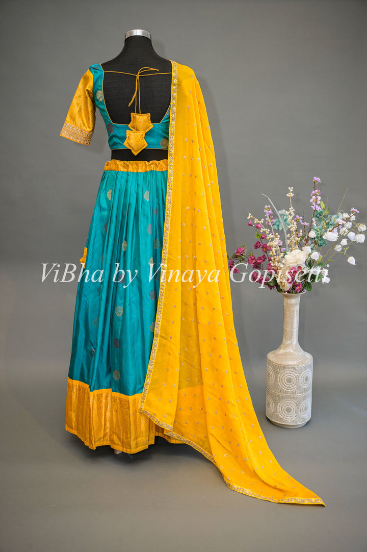 Teal Blue and Yellow Gadwal Silk Lehenga With Embroidered Borders And Yellow Embroidered Dupatta