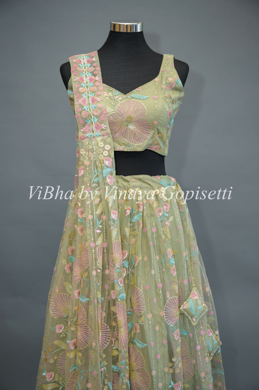 Pastel Green Net embroidered Lehenga Set With Sleeveless Blouse