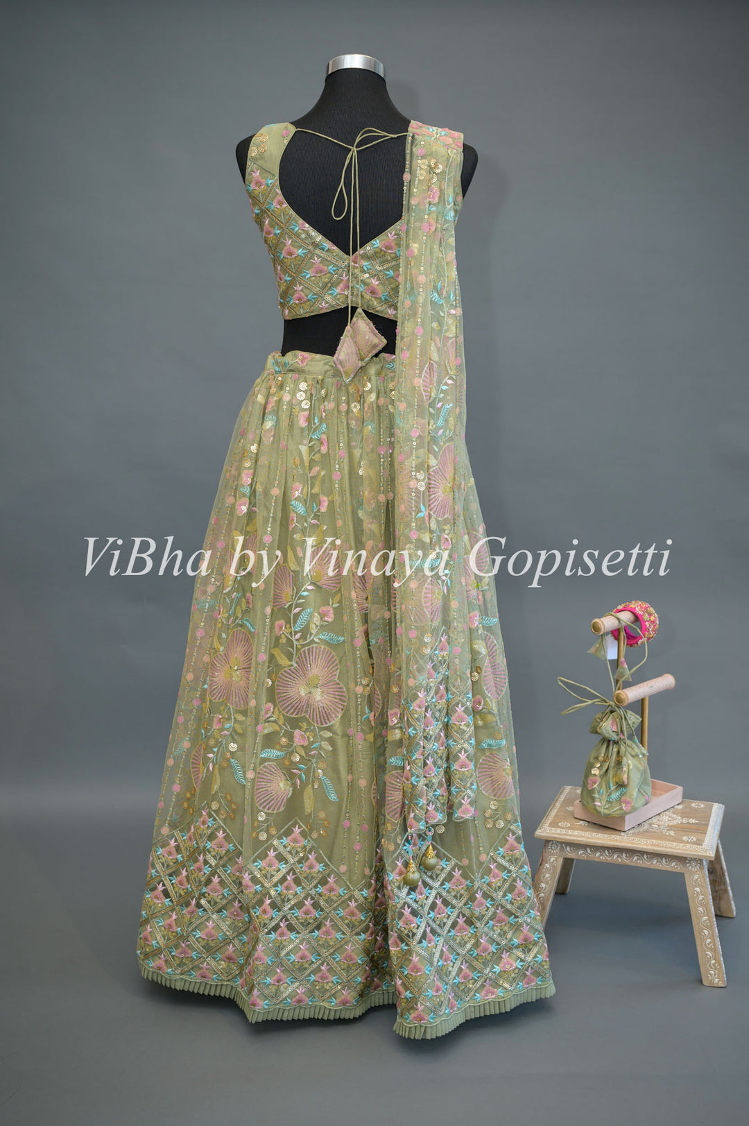 Pastel Green Net embroidered Lehenga Set With Sleeveless Blouse