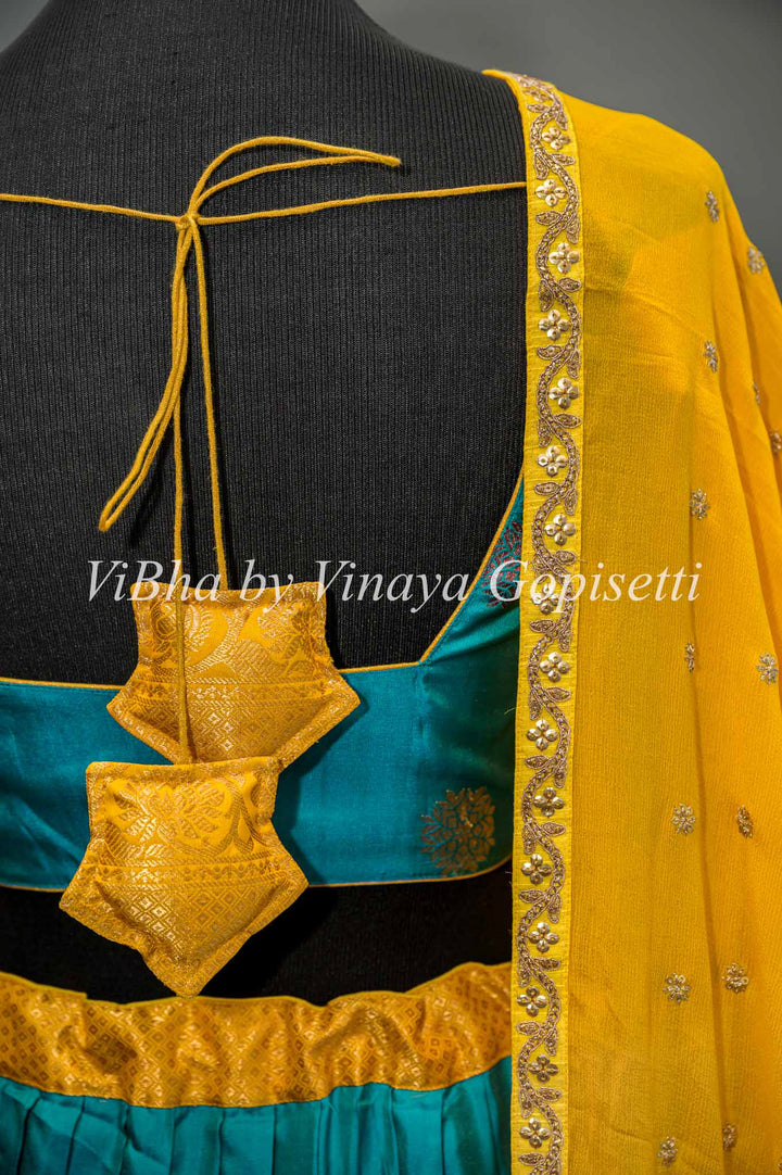 Teal Blue and Yellow Gadwal Silk Lehenga With Embroidered Borders And Yellow Embroidered Dupatta