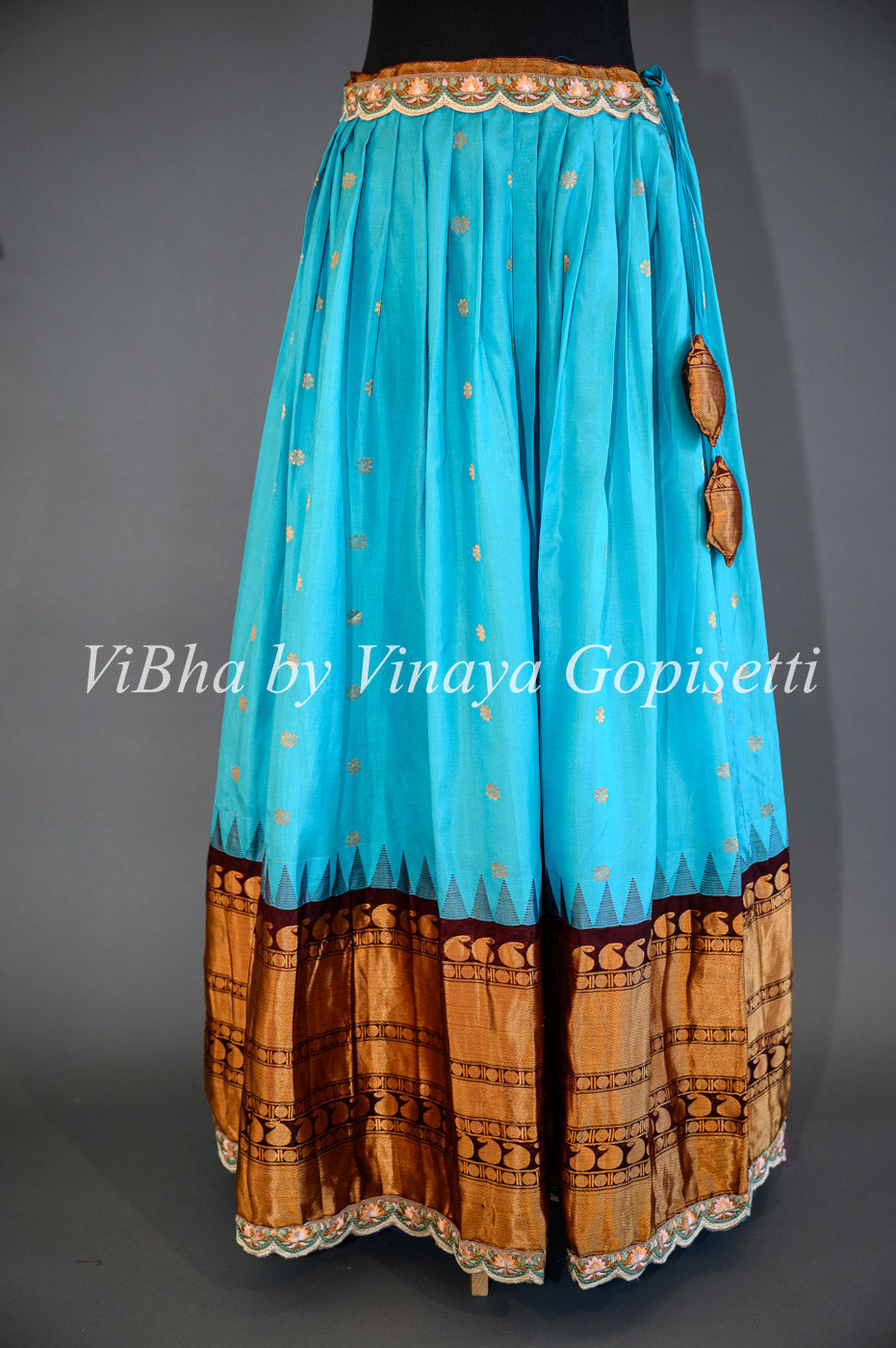 Dark Sky Blue and Brown Gadwal Silk Lehenga with Embroidered Borders And Peach Net Embroidered  Dupatta