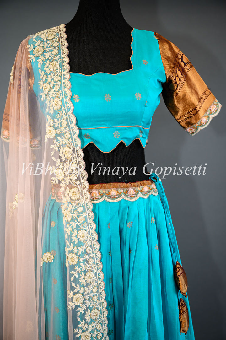 Dark Sky Blue and Brown Gadwal Silk Lehenga with Embroidered Borders And Peach Net Embroidered  Dupatta