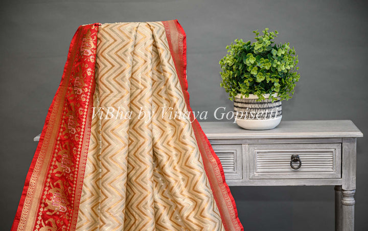 Butter Cream And Dark Red Banarasi Katan Silk Saree And Blouse With Patola Borders and Pallu.