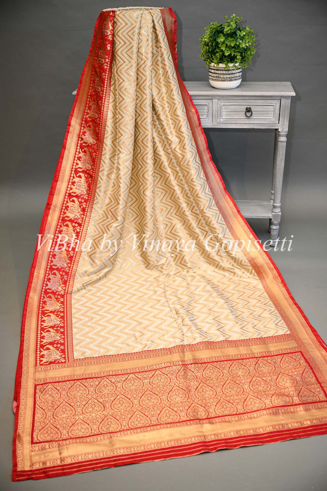 Butter Cream And Dark Red Banarasi Katan Silk Saree And Blouse With Patola Borders and Pallu.