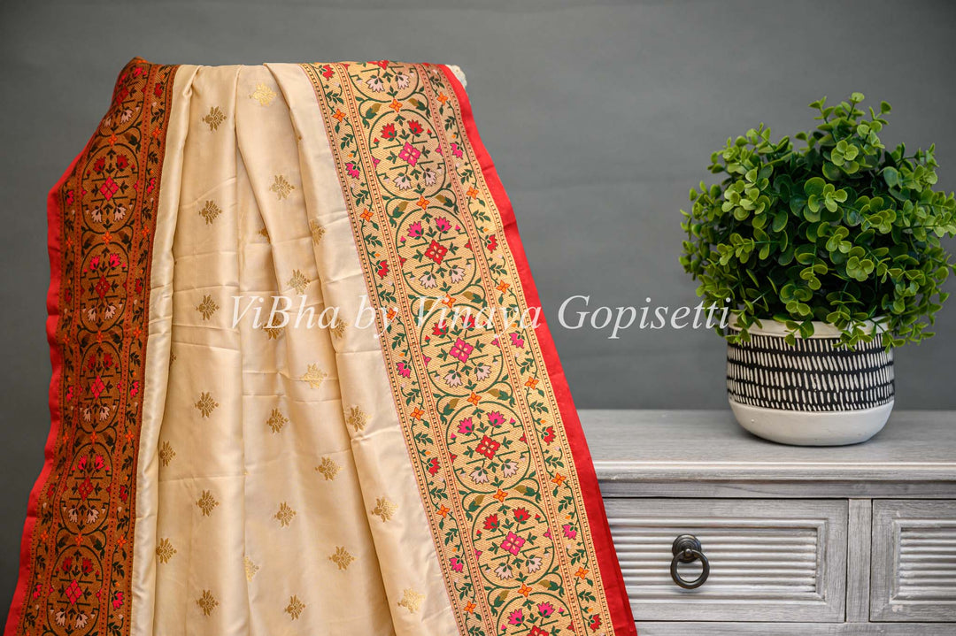 Butter Cream And Dark Red Banarasi Katan Silk Saree And Blouse With Paithani Borders and Pallu.