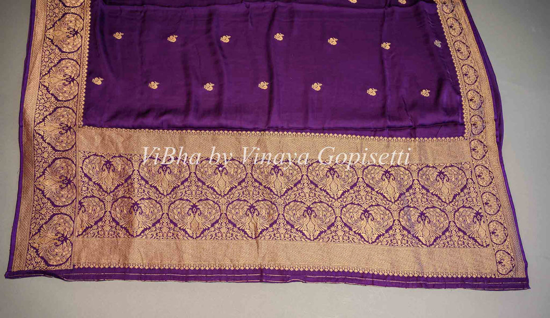 Purple Banarasi Silk Saree And Blouse With Gold Zari Motifs And Borders.