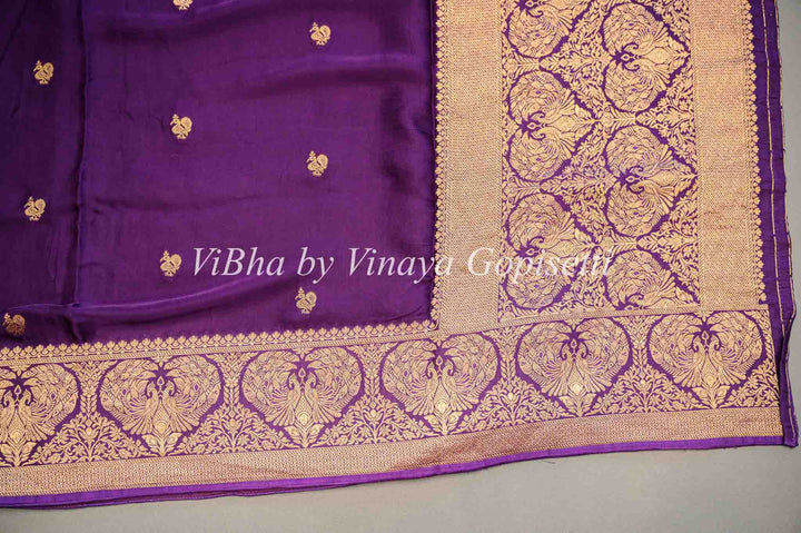 Purple Banarasi Silk Saree And Blouse With Gold Zari Motifs And Borders.