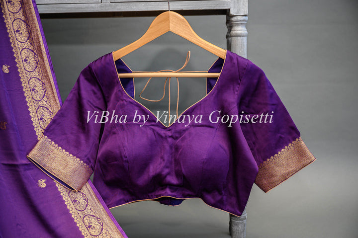 Purple Banarasi Silk Saree And Blouse With Gold Zari Motifs And Borders.