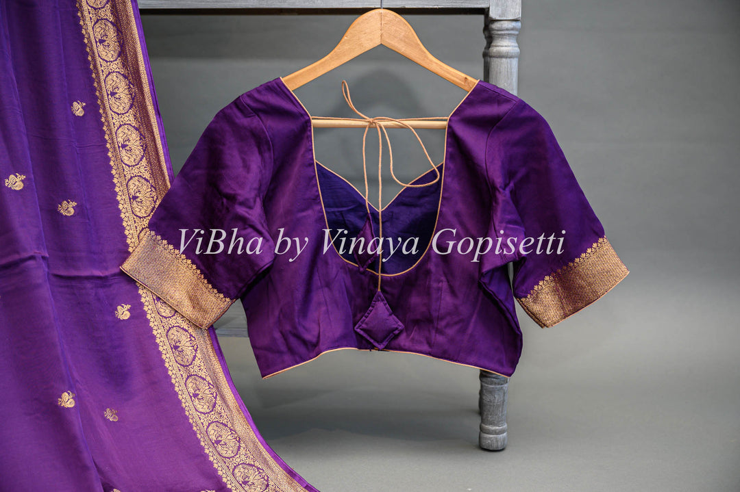 Purple Banarasi Silk Saree And Blouse With Gold Zari Motifs And Borders.