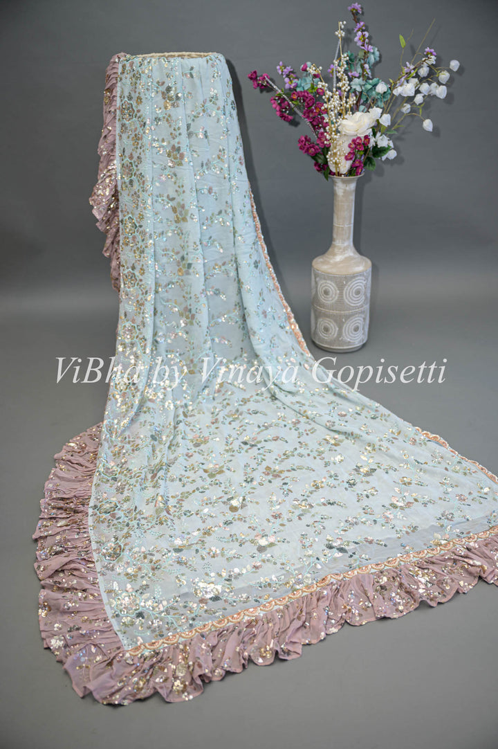 Pastel Blue And Mauve Georgette Sequins Ruffle Border Saree And Blouse