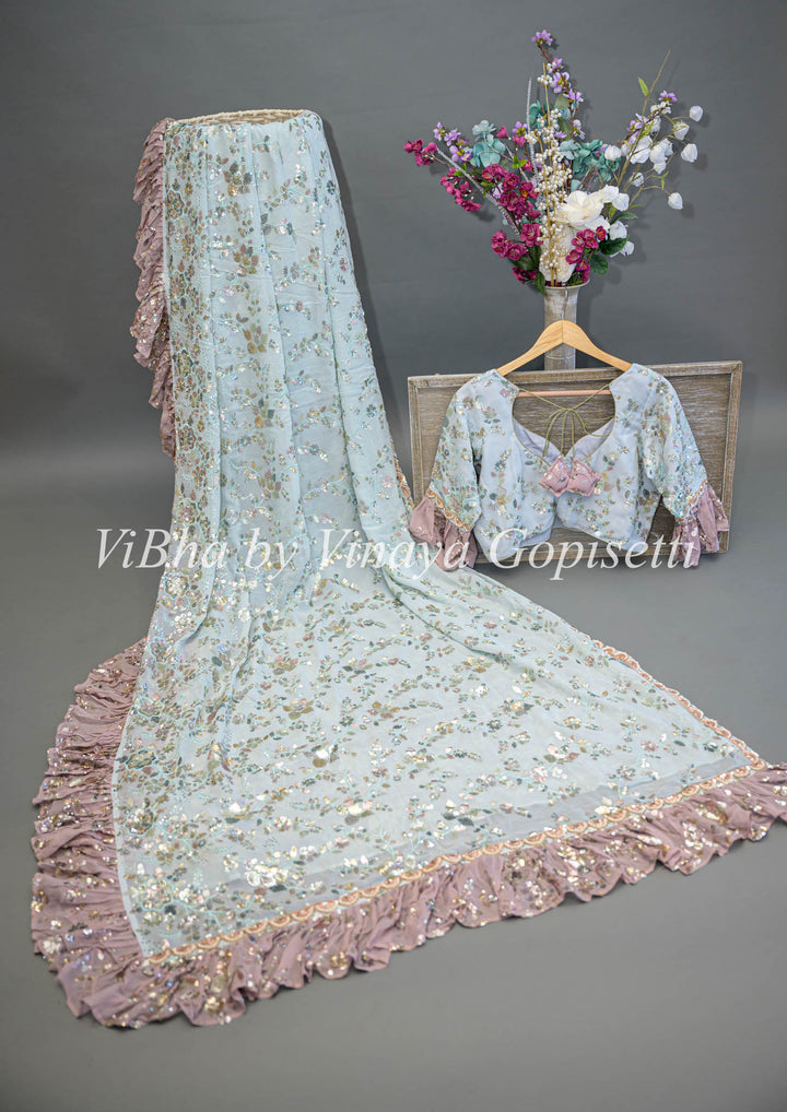 Pastel Blue And Mauve Georgette Sequins Ruffle Border Saree And Blouse