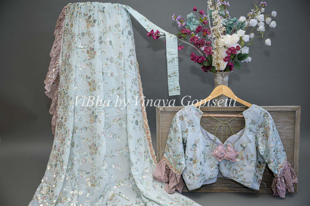 Pastel Blue And Mauve Georgette Sequins Ruffle Border Saree And Blouse