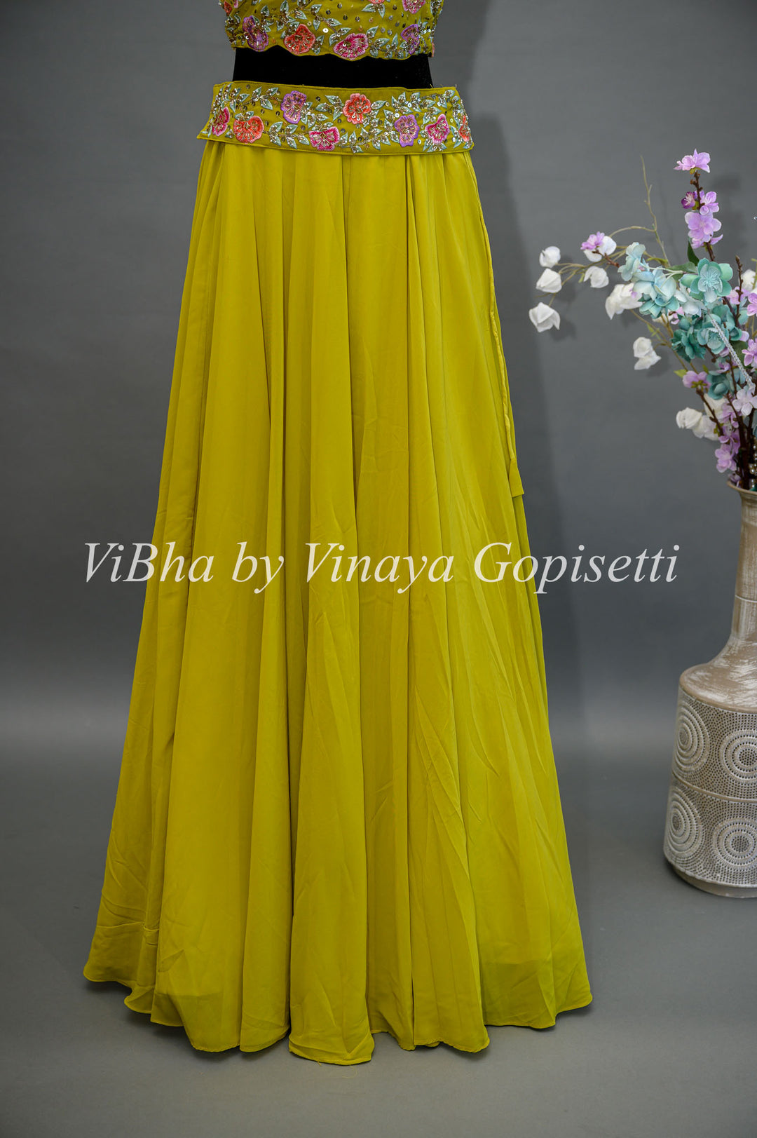 Citrus Green Lehenga with Embroidered Sleeveless Blouse and detachable Cape