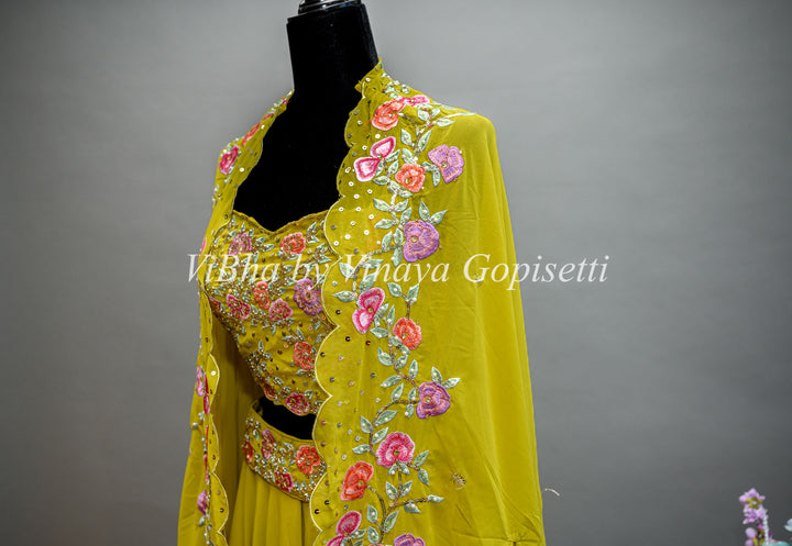 Citrus Green Lehenga with Embroidered Sleeveless Blouse and detachable Cape