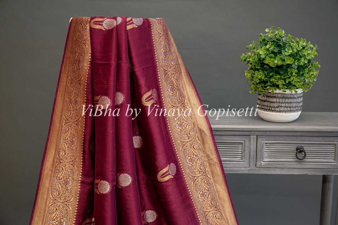 Burgundy Banarasi Kora Silk Saree With Gold And Silver Motifs and Borders