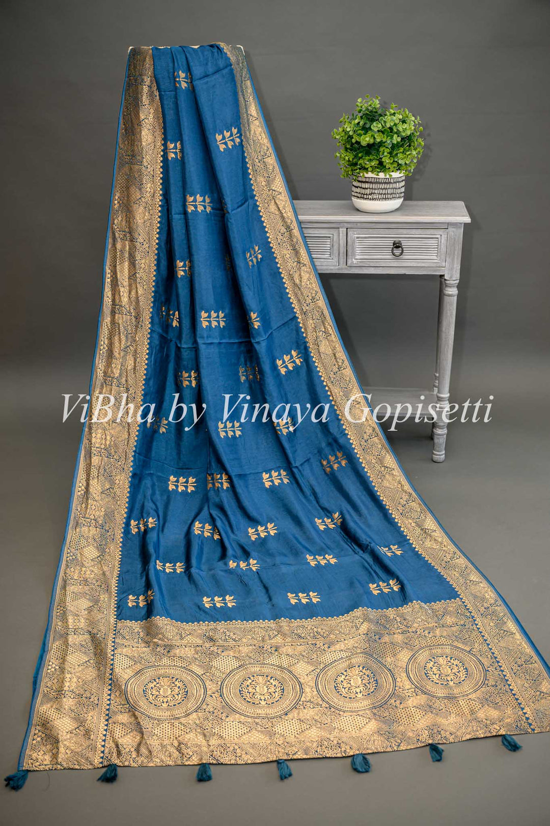 Teal Blue Banarasi Silk Saree And Blouse With Flower Motifs.