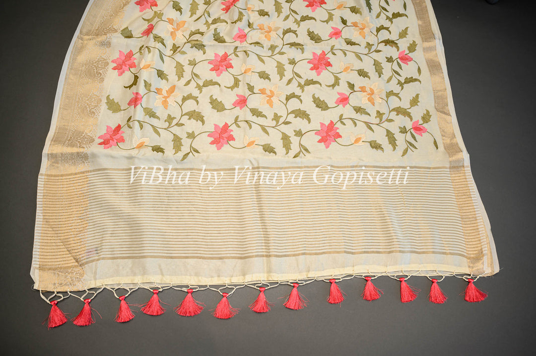 Off -White Banarasi Silk Saree And Blouse With Floral Thread Embroidery.