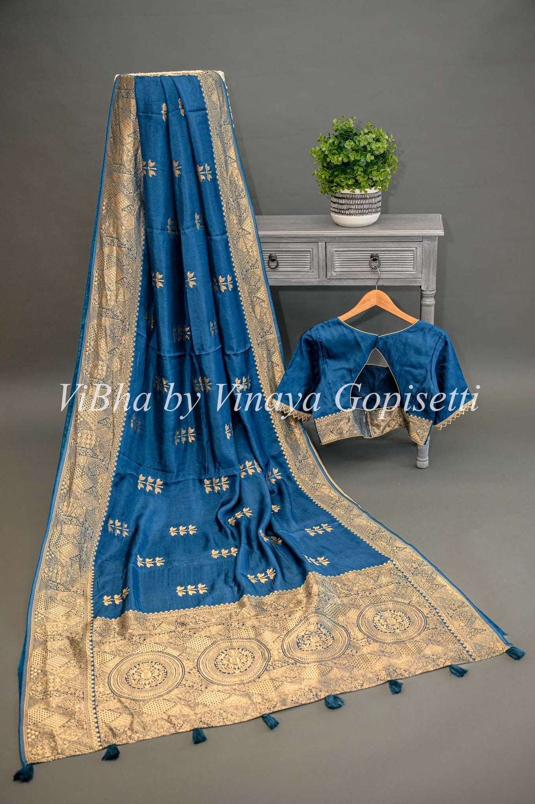 Teal Blue Banarasi Silk Saree And Blouse With Flower Motifs.