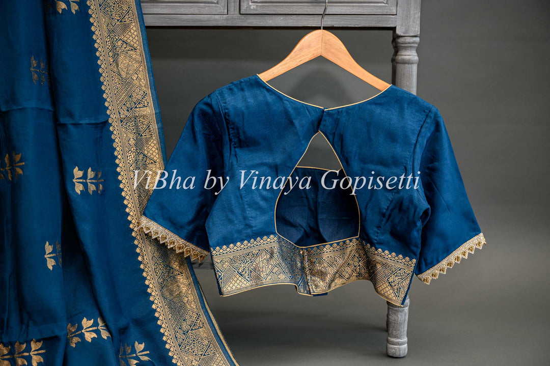 Teal Blue Banarasi Silk Saree And Blouse With Flower Motifs.