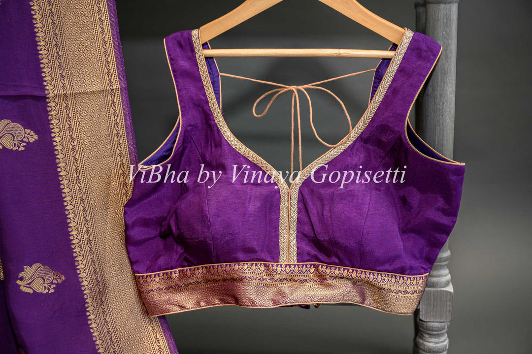 Purple Banarasi Silk Saree And Blouse With Gold Zari Motifs And Borders.