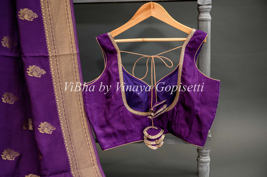 Purple Banarasi Silk Saree And Blouse With Gold Zari Motifs And Borders.