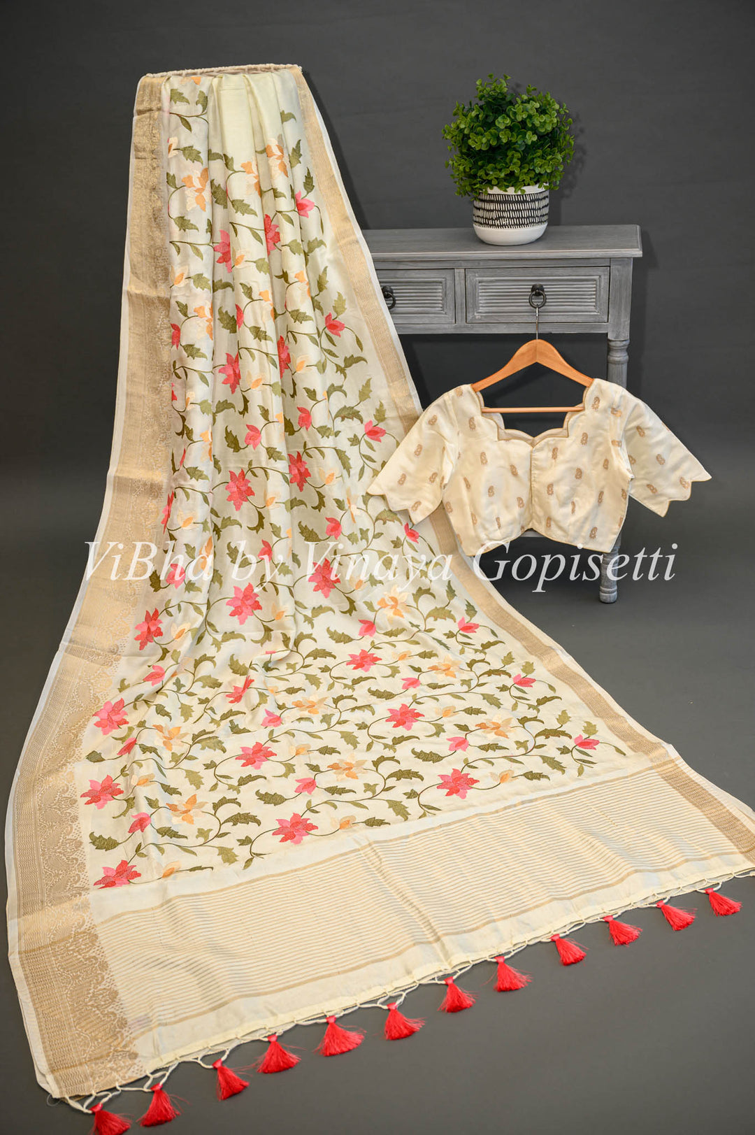 Off -White Banarasi Silk Saree And Blouse With Floral Thread Embroidery.