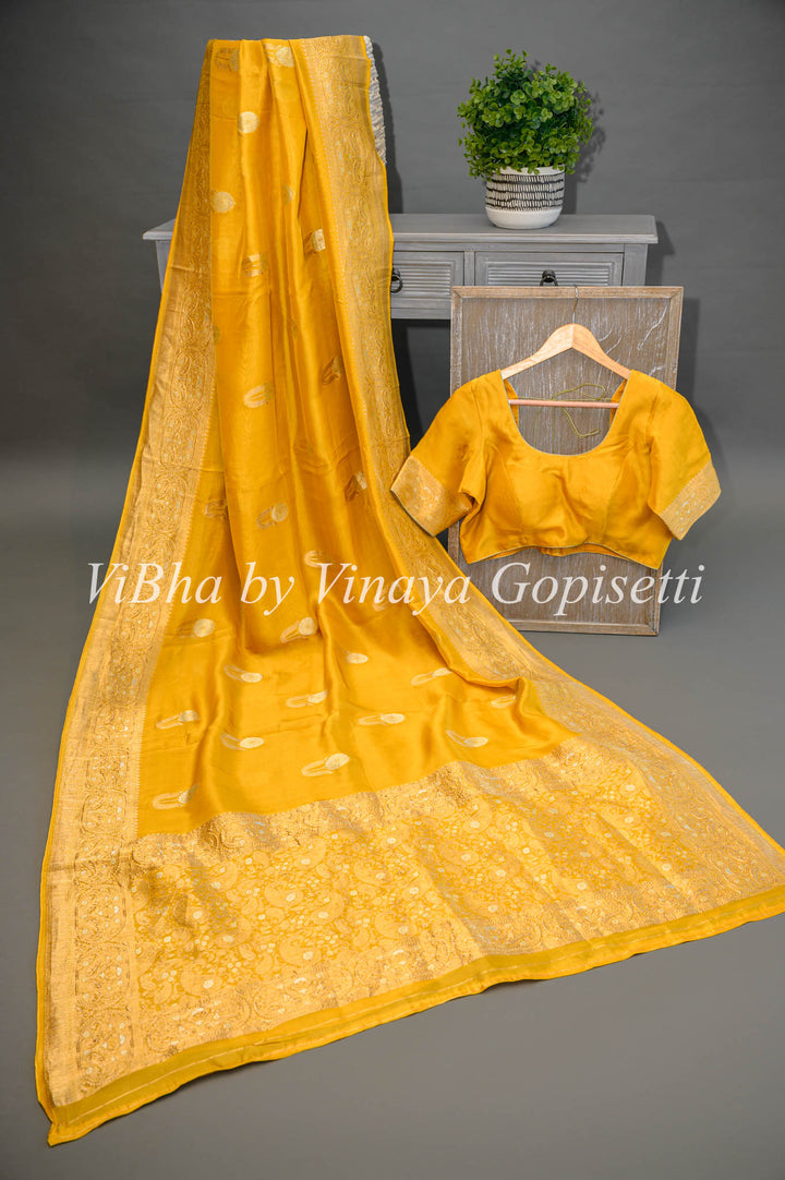 Yellow Banarasi Kora Silk Saree With Gold And Silver Motifs and Borders