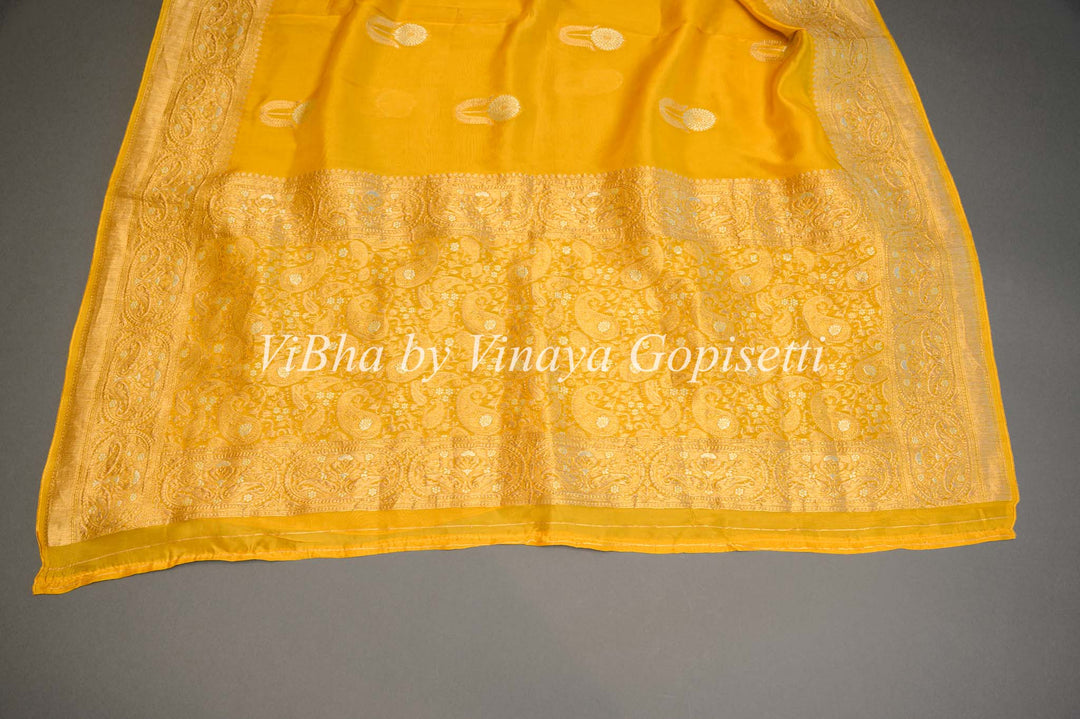 Yellow Banarasi Kora Silk Saree With Gold And Silver Motifs and Borders