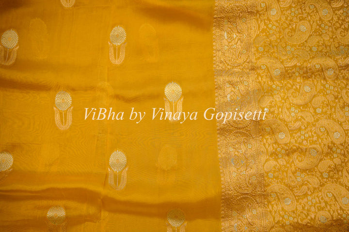 Yellow Banarasi Kora Silk Saree With Gold And Silver Motifs and Borders