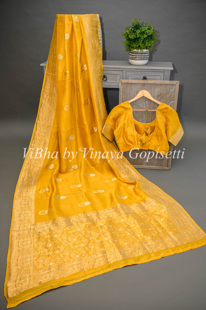 Yellow Banarasi Kora Silk Saree With Gold And Silver Motifs and Borders