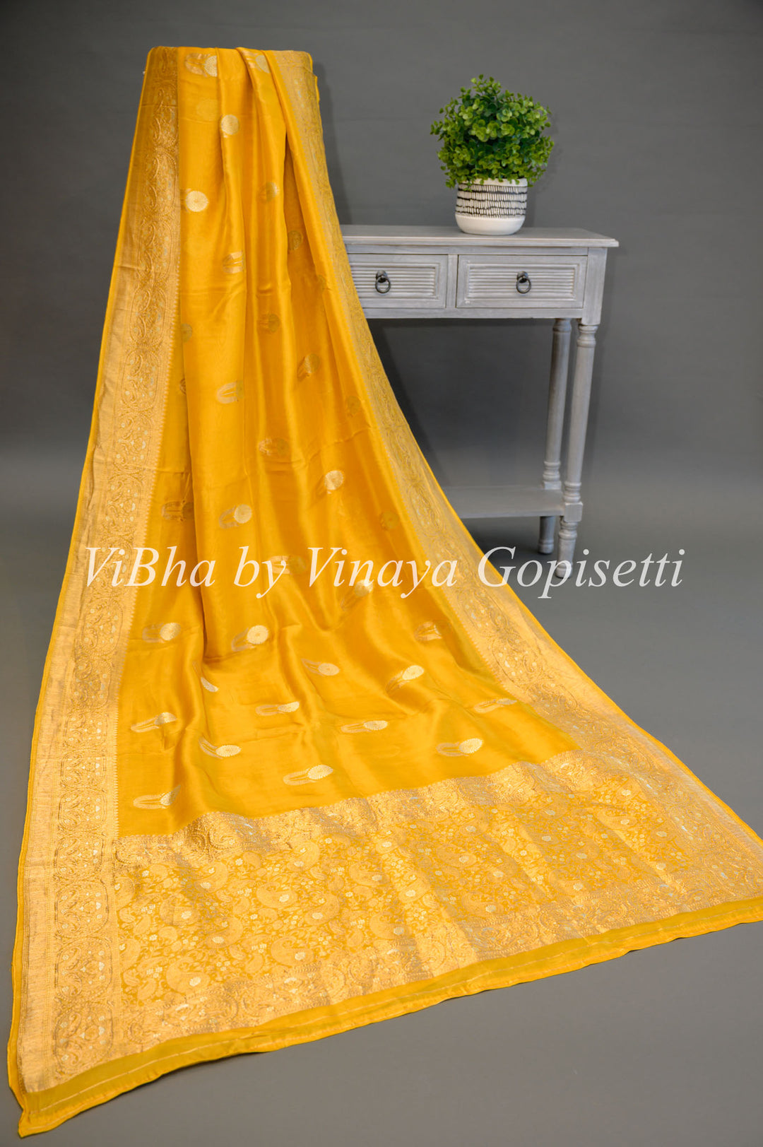 Yellow Banarasi Kora Silk Saree With Gold And Silver Motifs and Borders