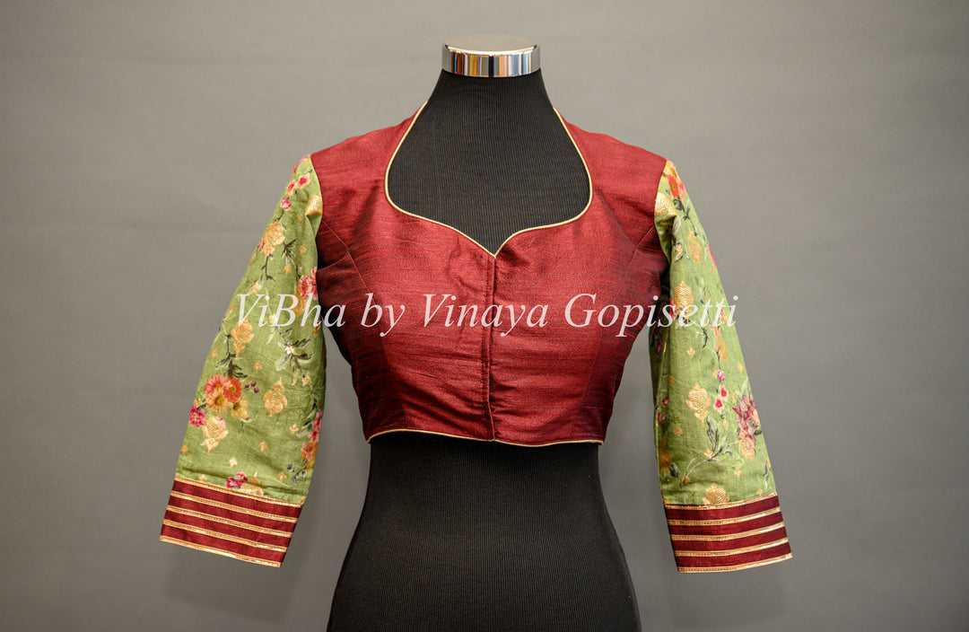 Maroon hand painted blouse with embroidery and floral sleeves.