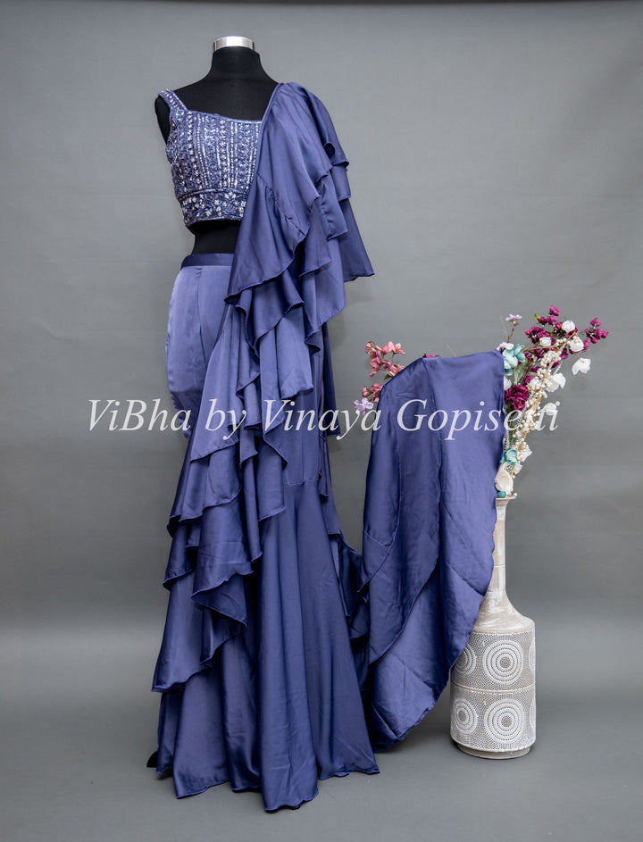 Ultra Violet Draped Saree with Ruffles And Embroidered Blouse