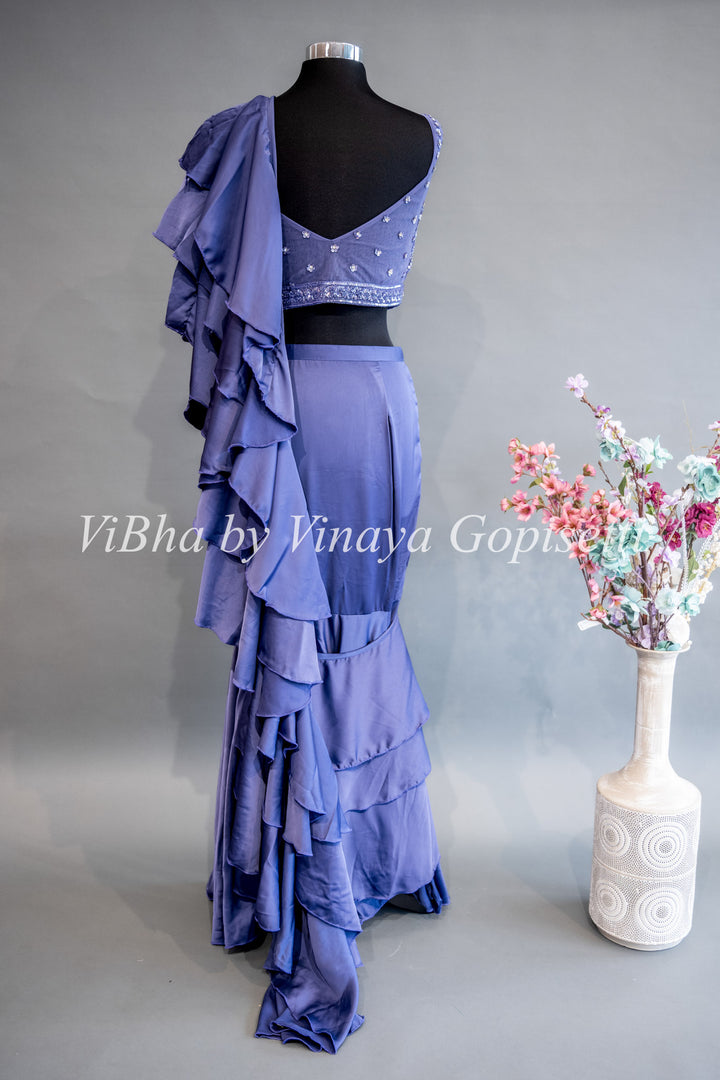 Ultra Violet Draped Saree with Ruffles And Embroidered Blouse