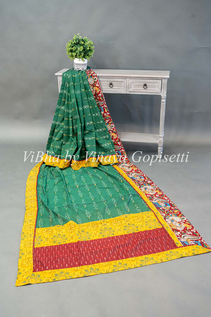 Green Ikkat Handloom Cotton With Yellow and Maroon Red Pen Kalamkari Borders Fusion Saree And Blouse