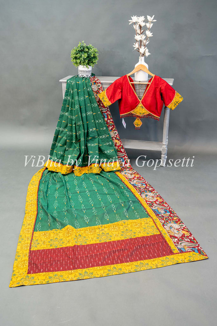 Green Ikkat Handloom Cotton With Yellow and Maroon Red Pen Kalamkari Borders Fusion Saree And Blouse