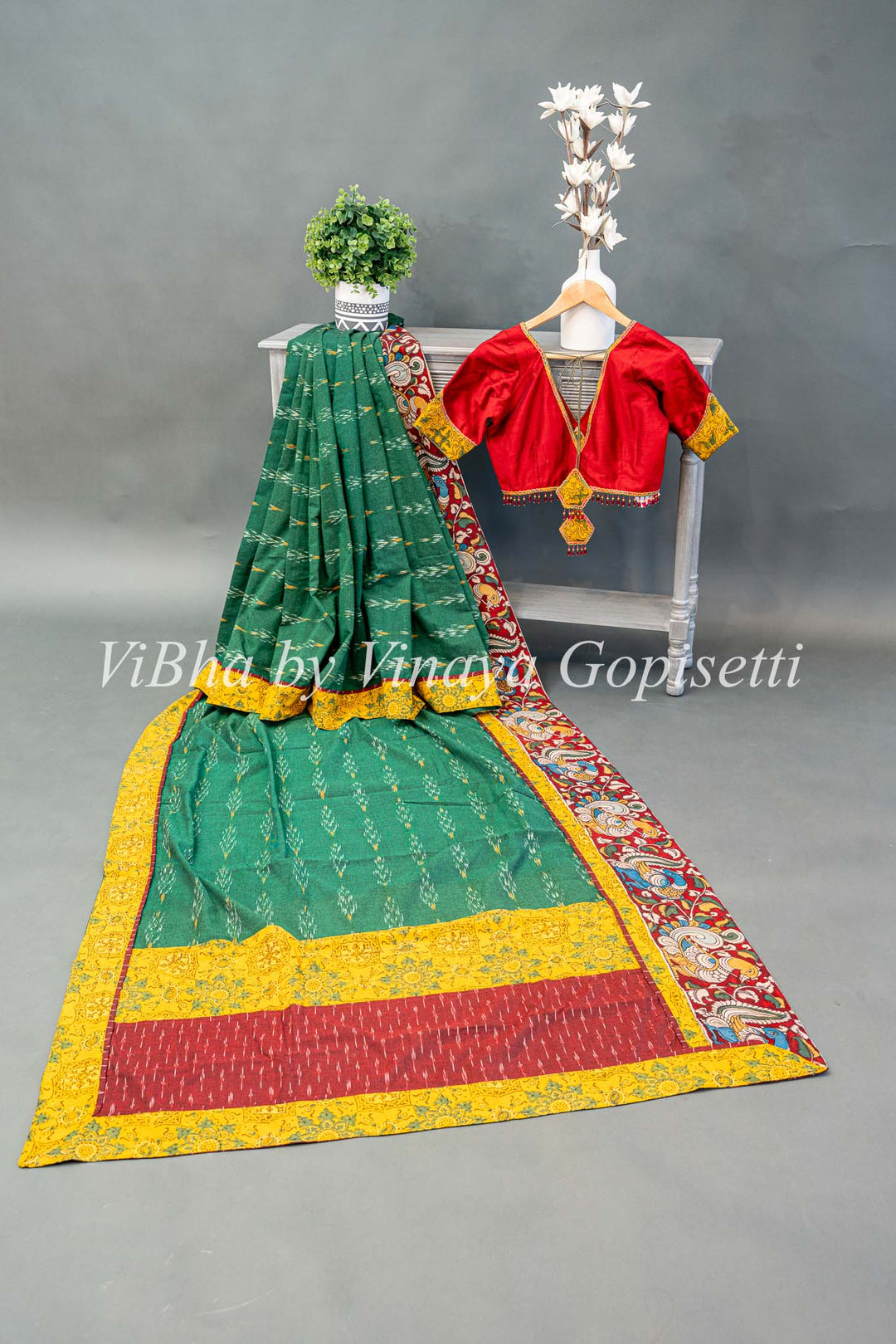 Green Ikkat Handloom Cotton With Yellow and Maroon Red Pen Kalamkari Borders Fusion Saree And Blouse