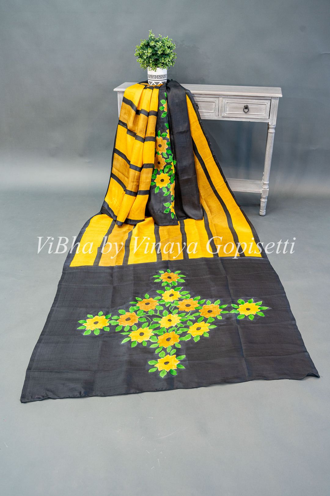 Yellow and Black Handpainted Tussar Silk Saree And Blouse