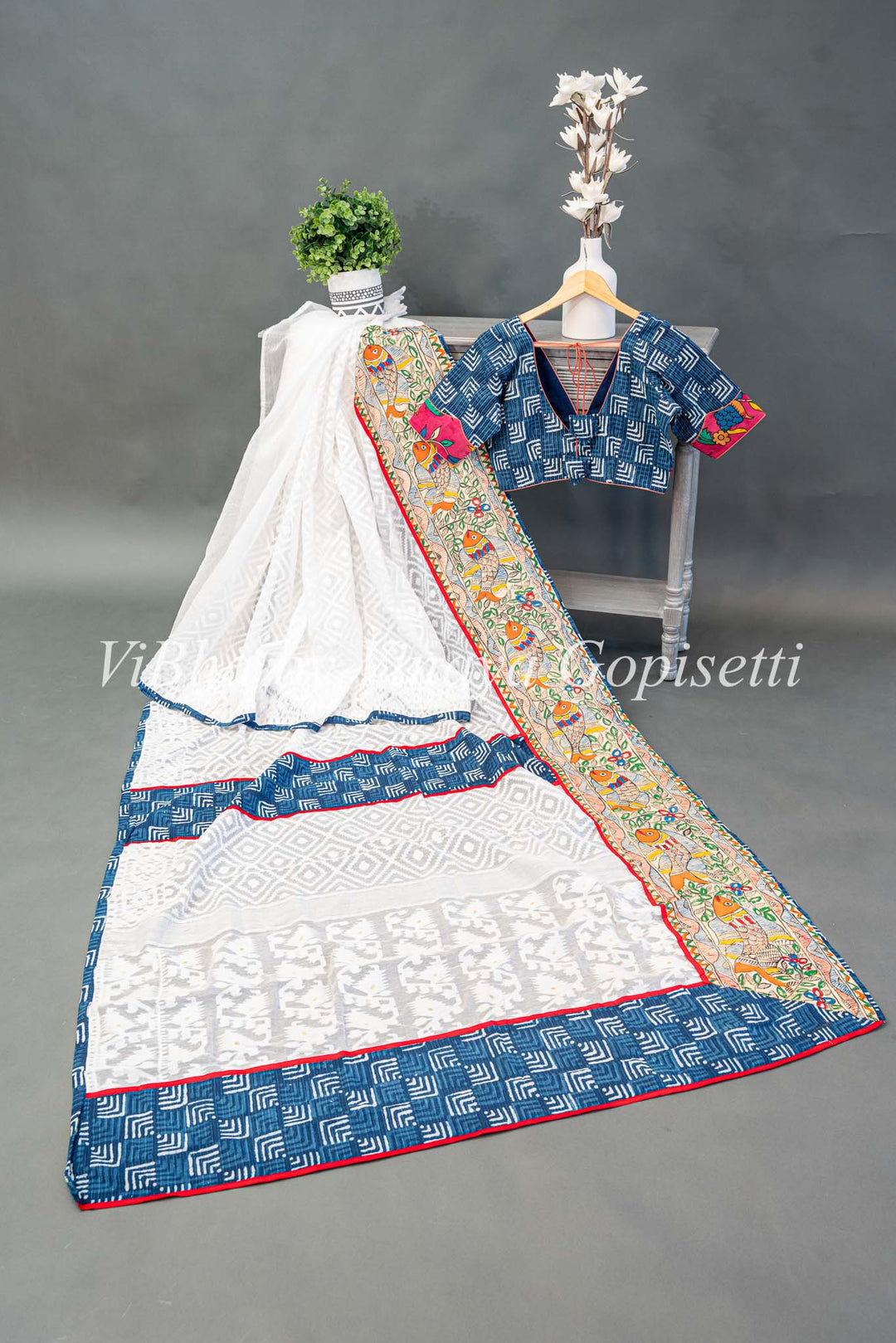 White and blue batik fusion saree with Fish motifs