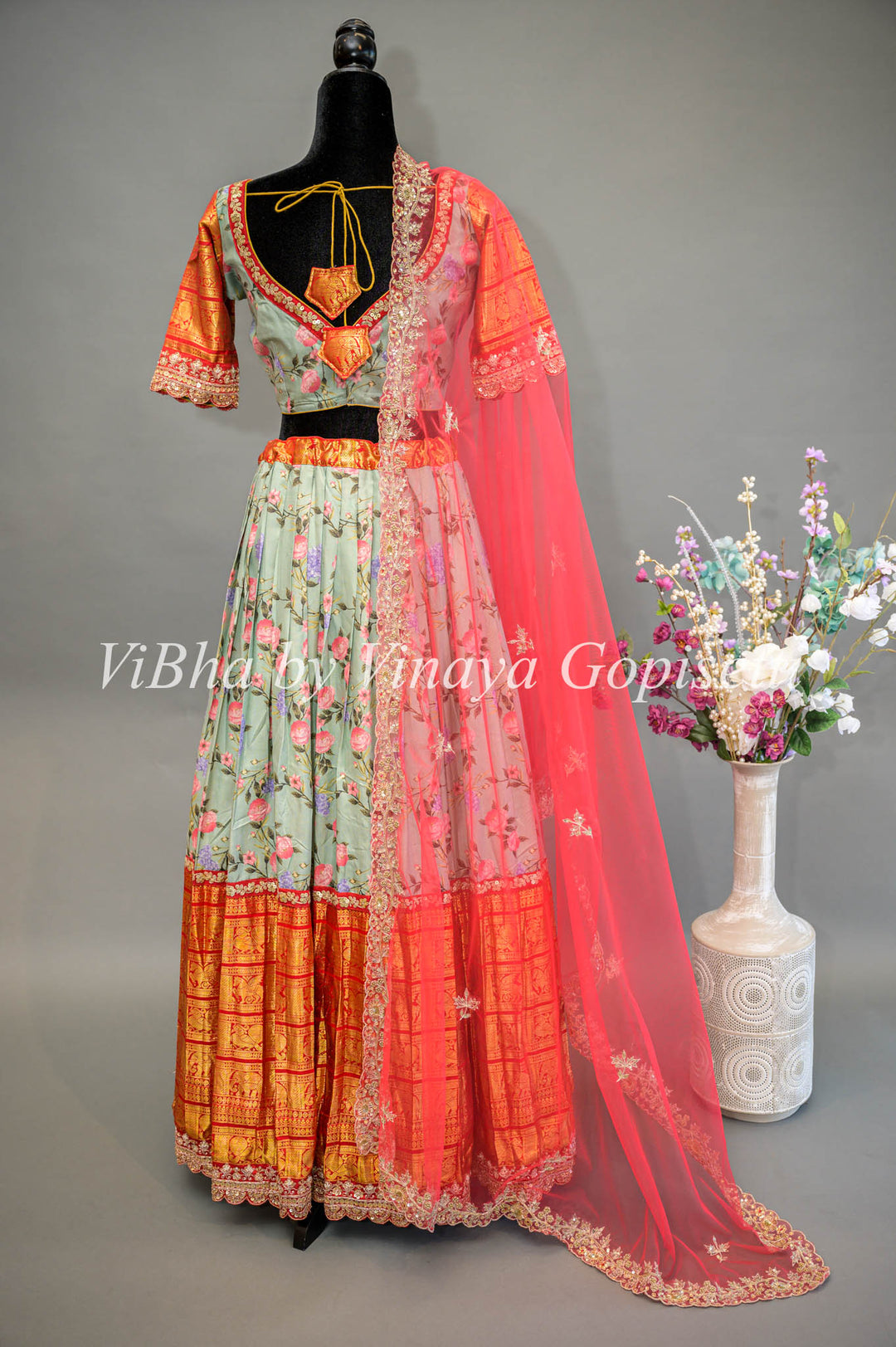 Light Green Floral Kanchi Silk Lehenga With Embroidered Borders And Red Net Embroidered Dupatta