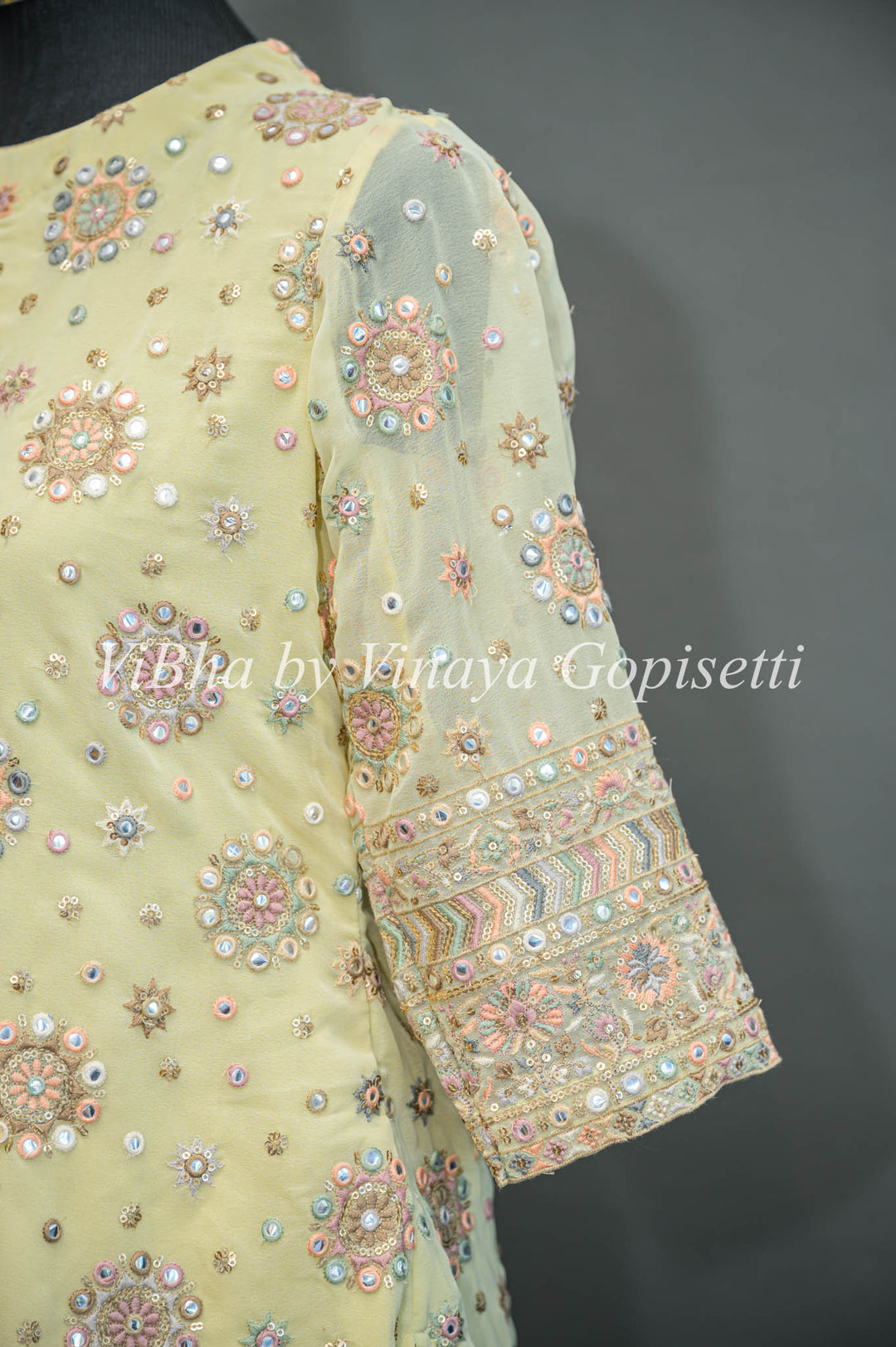 Pastel Yellow Embroidered Sharara Set With Choker Dupatta And Matching Potli Bag