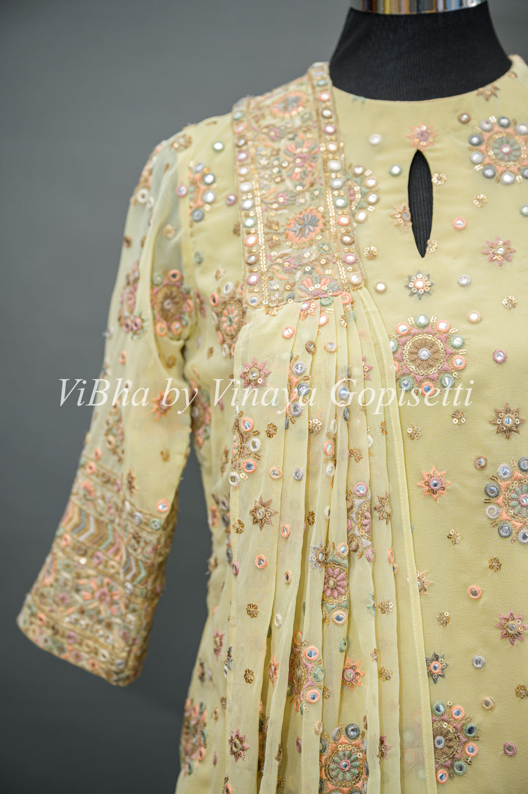 Pastel Yellow Embroidered Sharara Set With Choker Dupatta And Matching Potli Bag