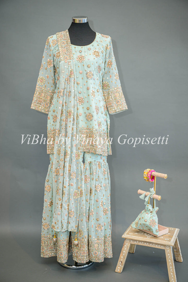 Pastel Blue Embroidered Sharara Set With Choker Dupatta And Matching Potli Bag