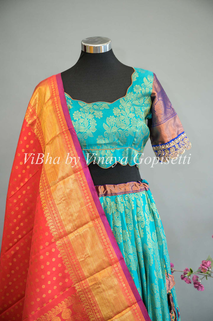 Turquoise and Royal Blue Kanchi Silk Lehenga With Embroidered Borders And Red Kanchi Silk Dupatta