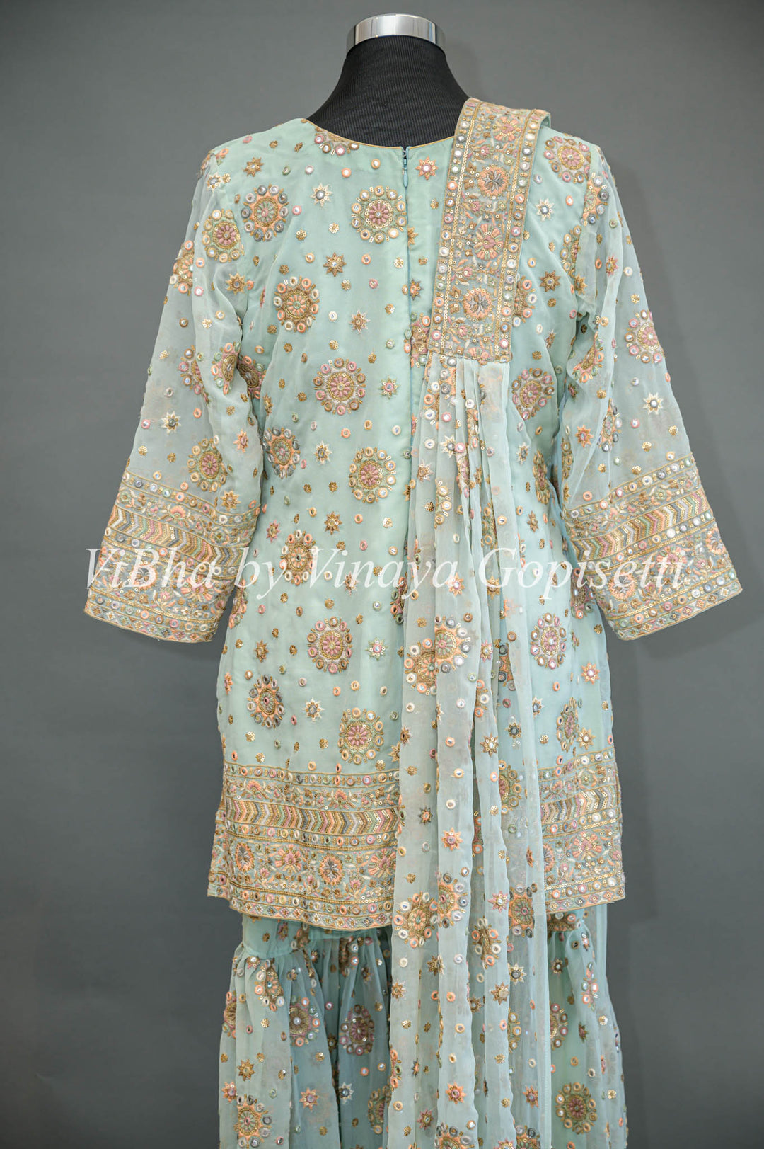 Pastel Blue Embroidered Sharara Set With Choker Dupatta And Matching Potli Bag