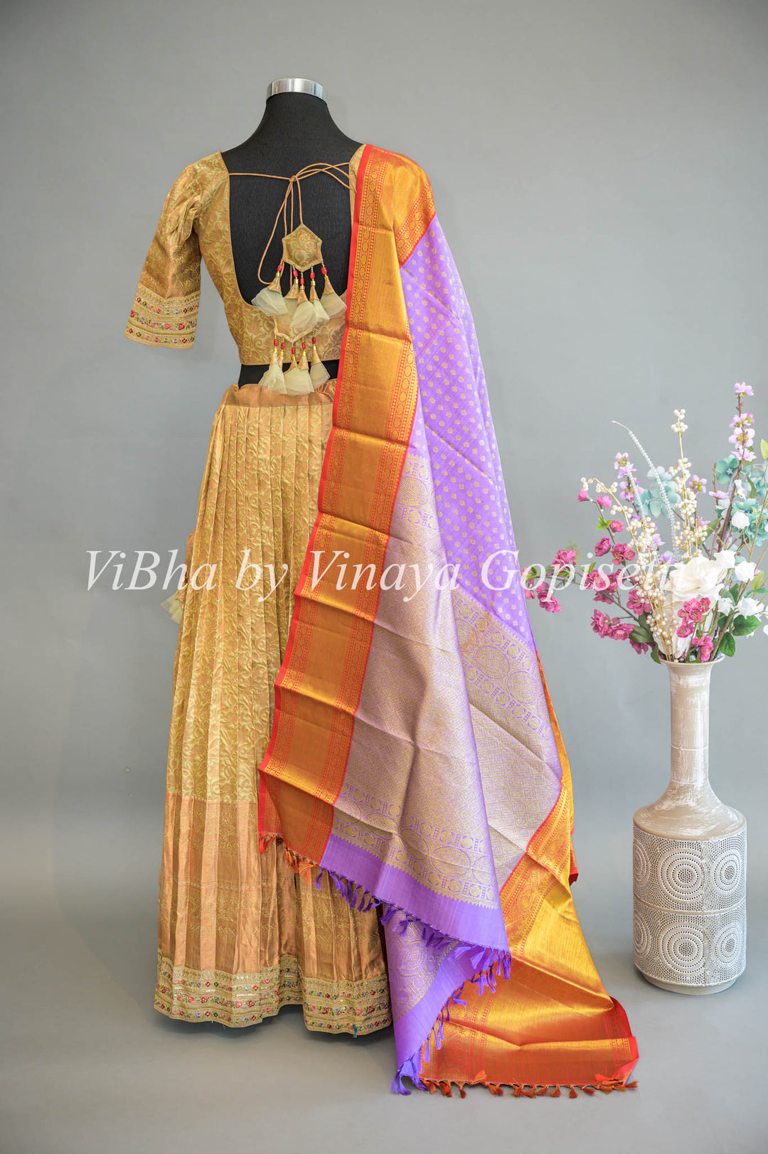 Pastel Green Copper Zari Kanchi Silk Lehenga With Embroidered Borders And Purple Kanchi Silk Dupatta