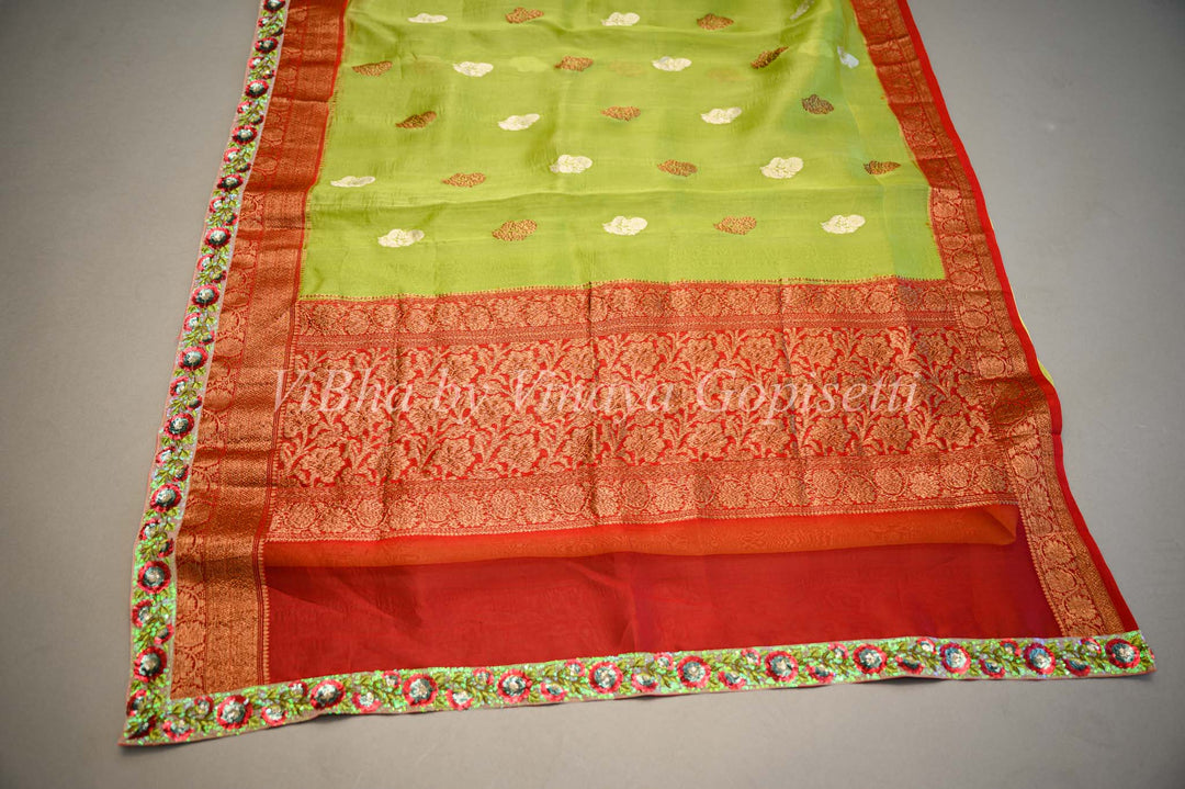 Parrot Green and Red Banarasi Organza Saree Embellished With Embroidered Borders